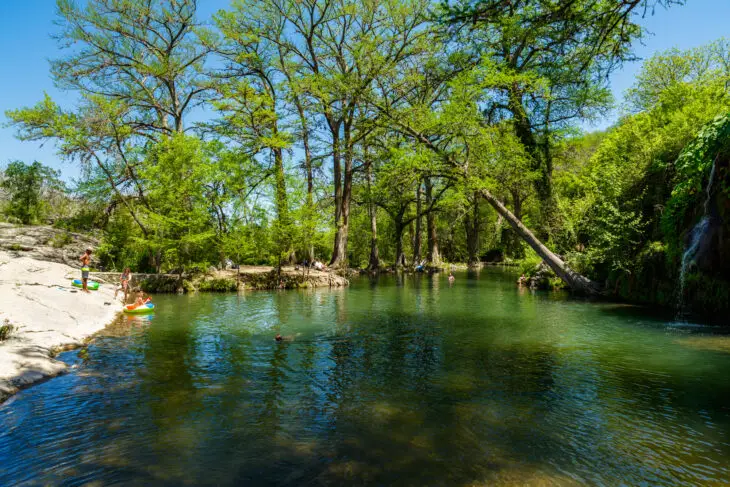 Krause Springs is a popular tourist destination with camping and swimming activities in the Texas Hill Country.